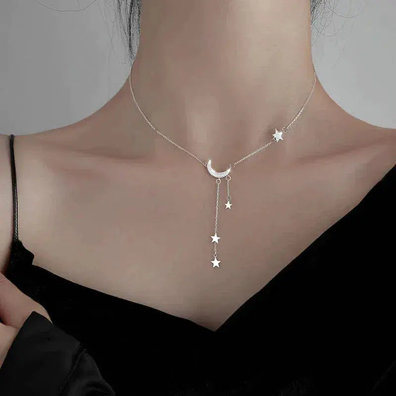 Elegant Silver Necklace with Moon and Stars
